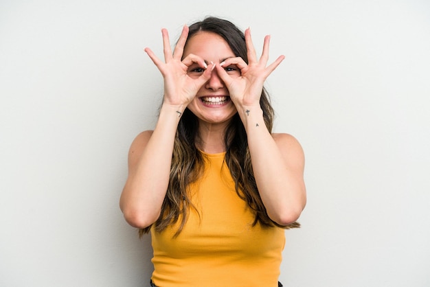 Excited keeping ok gesture on eye