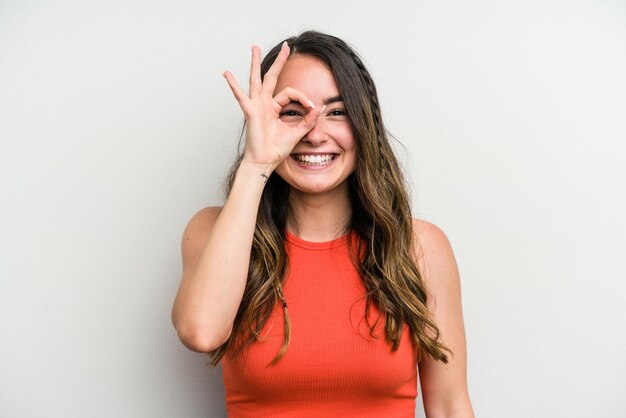 excited keeping ok gesture on eye