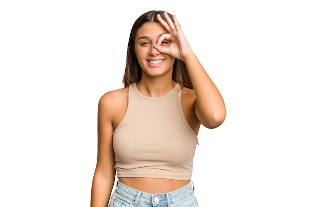 Excited keeping ok gesture on eye