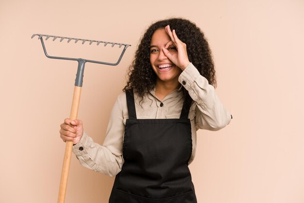 Excited keeping ok gesture on eye