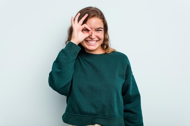 Excited keeping ok gesture on eye