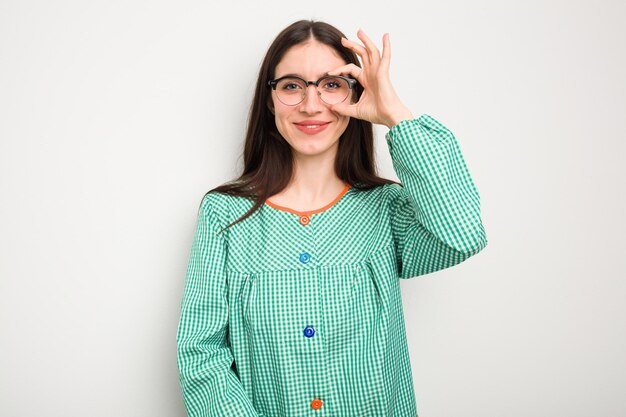 Excited keeping ok gesture on eye