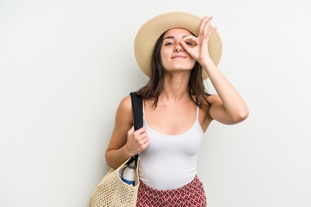 Excited keeping ok gesture on eye