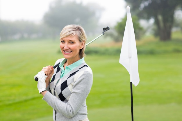 Excited lady golfer standing