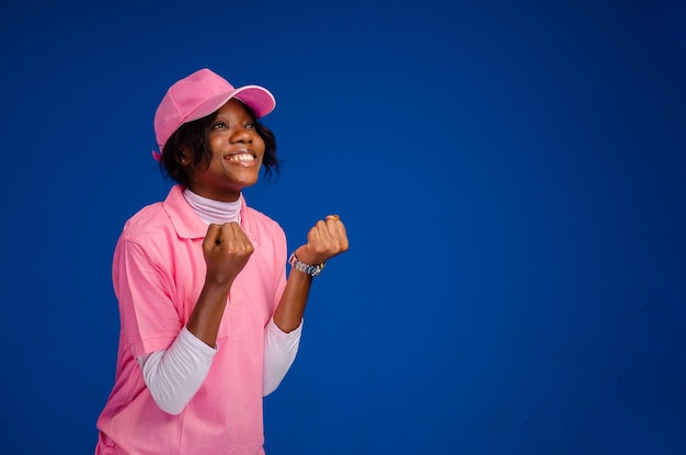 Excited lady isolated over blue background