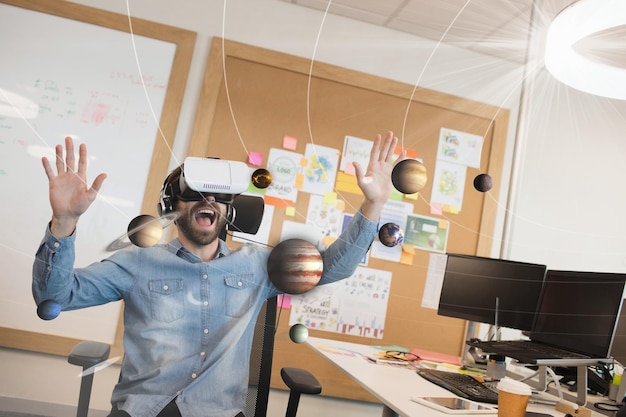 Photo excited man in vr headset looking at 3d planets