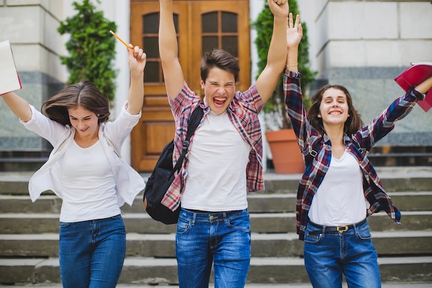 Excited students leaving university