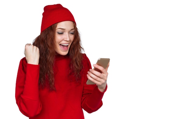 Photo excited stylish woman reading news on smartphone