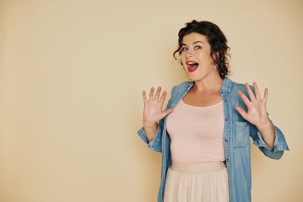 Excited surprised young woman