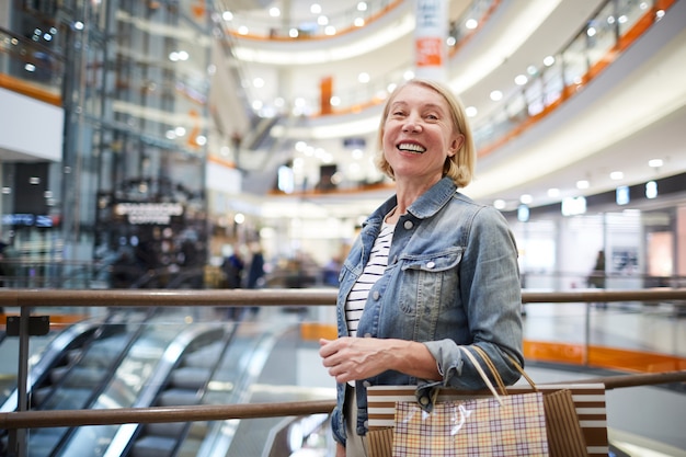 Excited woman in shopping mall