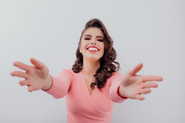 Excited woman stretching out her arms