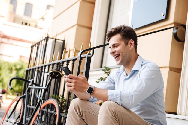 Excited young stylish man dressed in shirt