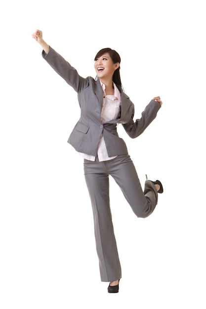 Exciting business woman raising hand