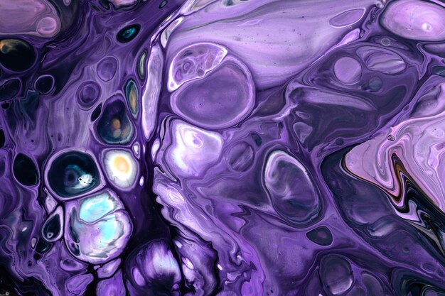 Exclusive beautiful pattern abstract fluid art background Flow of blending purple lilac paints mixing together Blots and streaks of ink texture for print and design