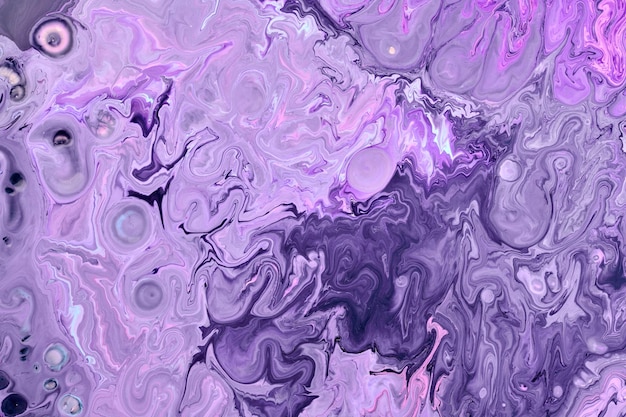 Photo exclusive beautiful pattern abstract fluid art background flow of blending purple lilac paints mixing together blots and streaks of ink texture for print and design