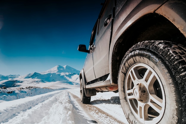 Excursion by off-road vehicle to the mountains in winter.