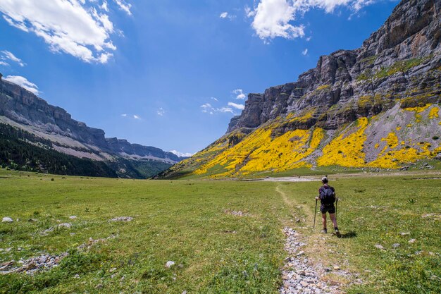 Excussionist woman in the stands of Soaso in Ordesa and Monte Perdido National park Aragon Huesca Spain