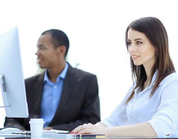 Photo executive business woman in office on the background of business team.photo with copy space