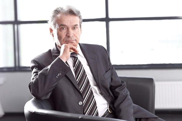 Executive businessman sitting in an office chair