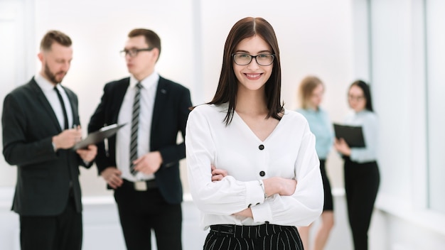 Executive serious businesswoman standing in the lobby office. photo with copy space