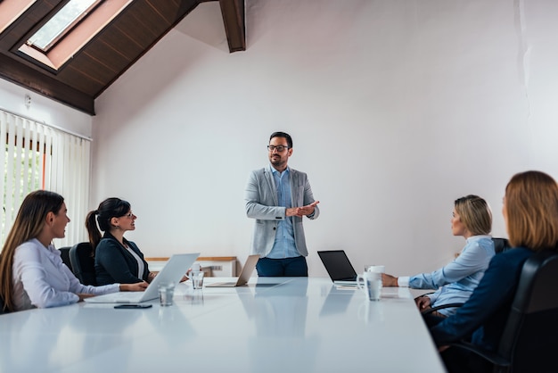 Executives having a meeting in conference room.