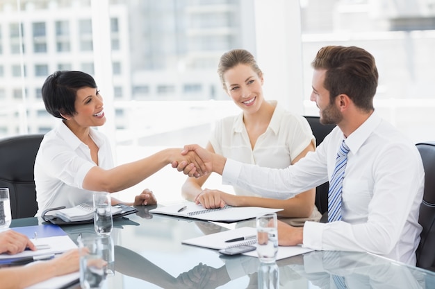 Executives shaking hands after a business meeting