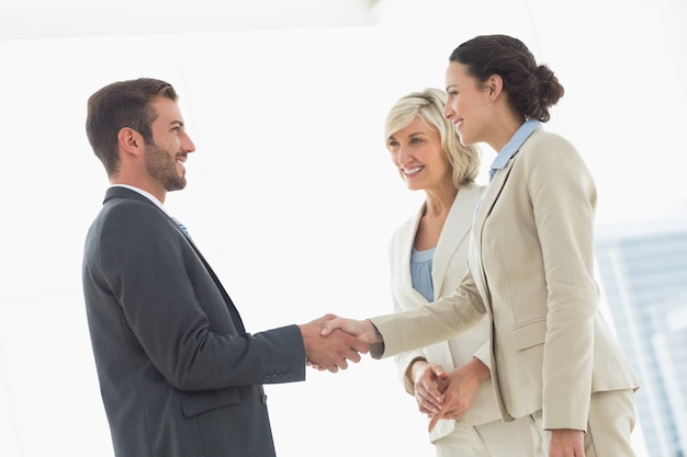 Executives shaking hands after a business meeting