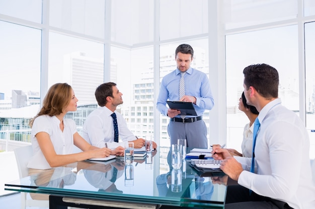 Executives sitting around conference table