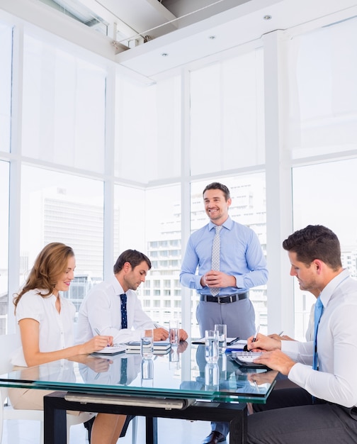 Executives sitting around conference table