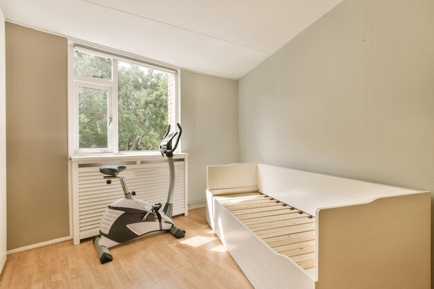 Photo an exercise bike in a room with a window