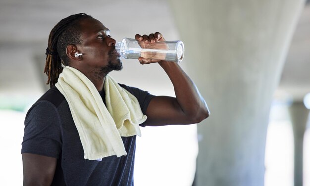 Premium Photo  Exercise black man and water bottle for workout