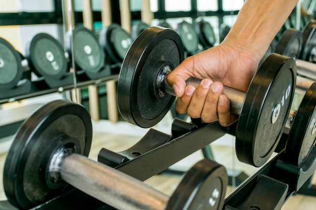 exercise with dumbbell in the gym