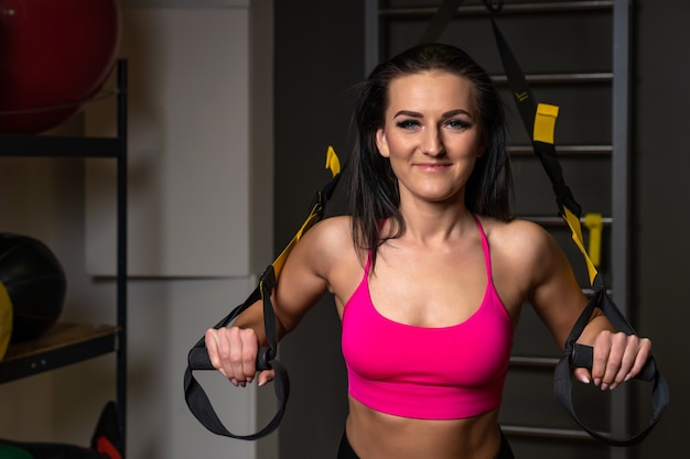 Photo exercises with a suspended strengthening system in gym