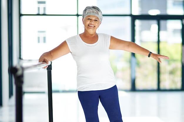 Exercising wth a smile Shot of a senior woman working out indoors