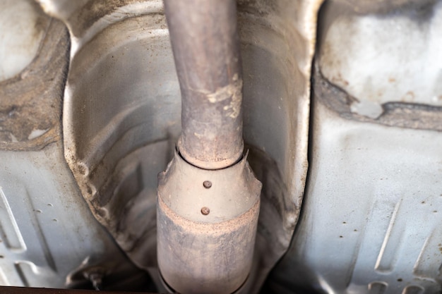 Exhaust pipe and catalyst system closeup view in the workshop