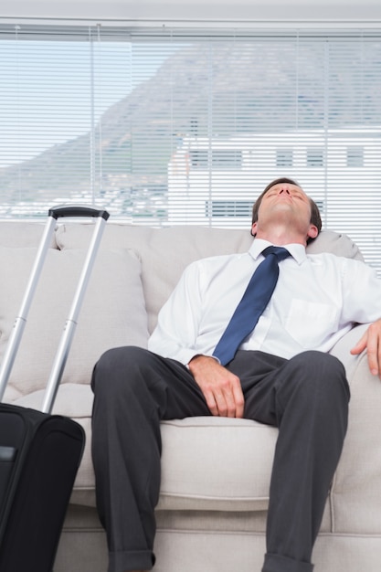 Exhausted businessman sleeping