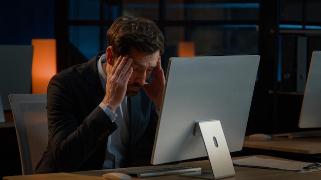 exhausted caucasian businessman adult man work overtime in office late night tired entrepreneur