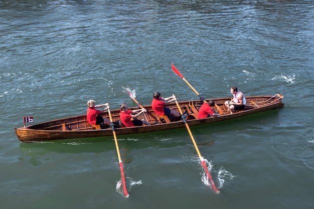 Photo exhausted at the end of a rowing boat race in whitby