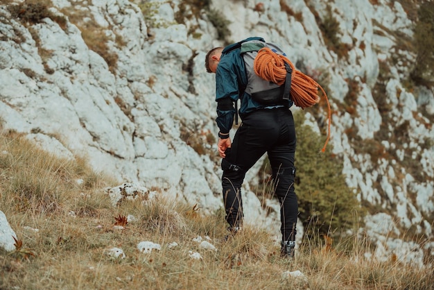 Exhausted sports man after outdoor activity Tired hiker after hiking route walking