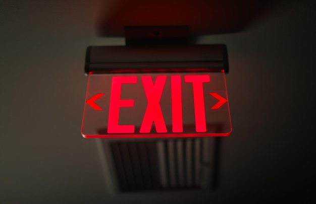 Photo exit sign glows brightly symbolizing safety and guidance in emergency situations in urban environme