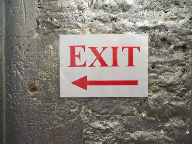 Exit sign with direction arrow