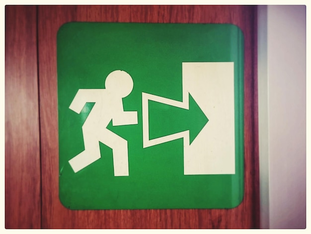 Exit sign on wooden door