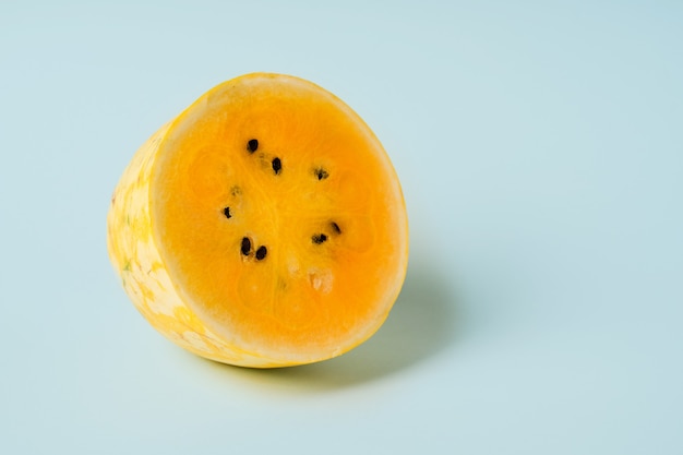 Exotic yellow watermelon on a blue background