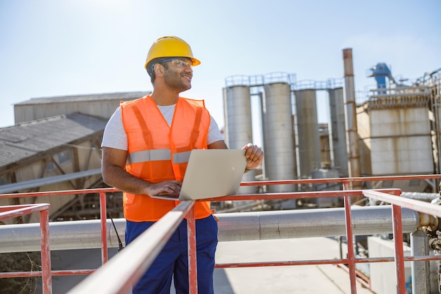 Experienced engineer working hard at heavy industry plant