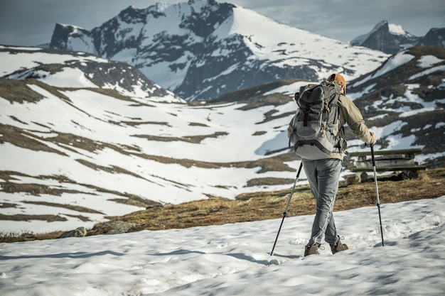 Experienced Hiker on Snowy Mountain Trail