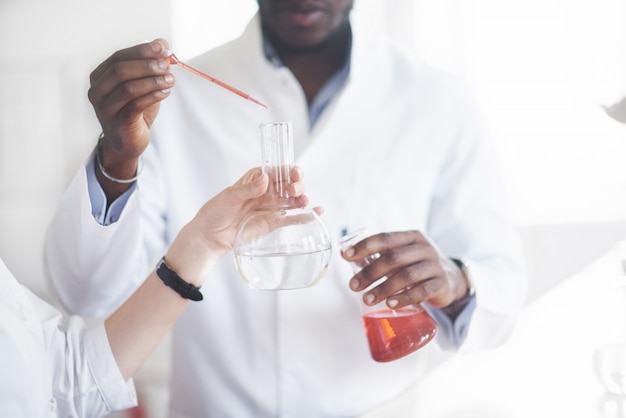 Experiments in the chemical laboratory. An experiment was carried out in a laboratory in transparent flasks