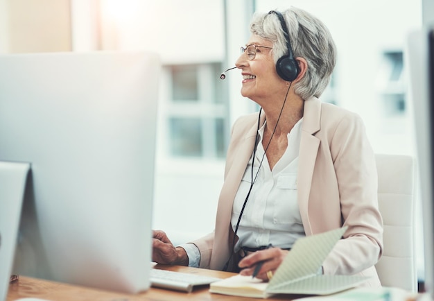 The expert in all things client related Shot of a happy senior woman working in a call center