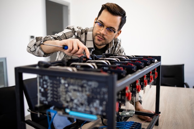 An expert or engineer setting up bitcoin rig for mining cryptocurrency