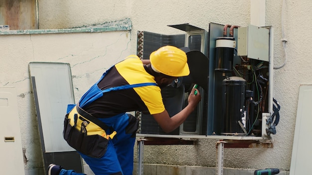 expert removing dust from blower fan