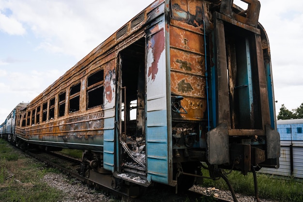 Exploded trains and wagons at the railway station in the city\
of trostyanets sumy region civil buildings russian military\
invasion of ukraine